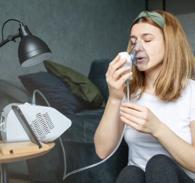 woman using nebulizer